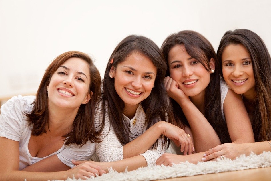 Group of women lying on the floor and smiling